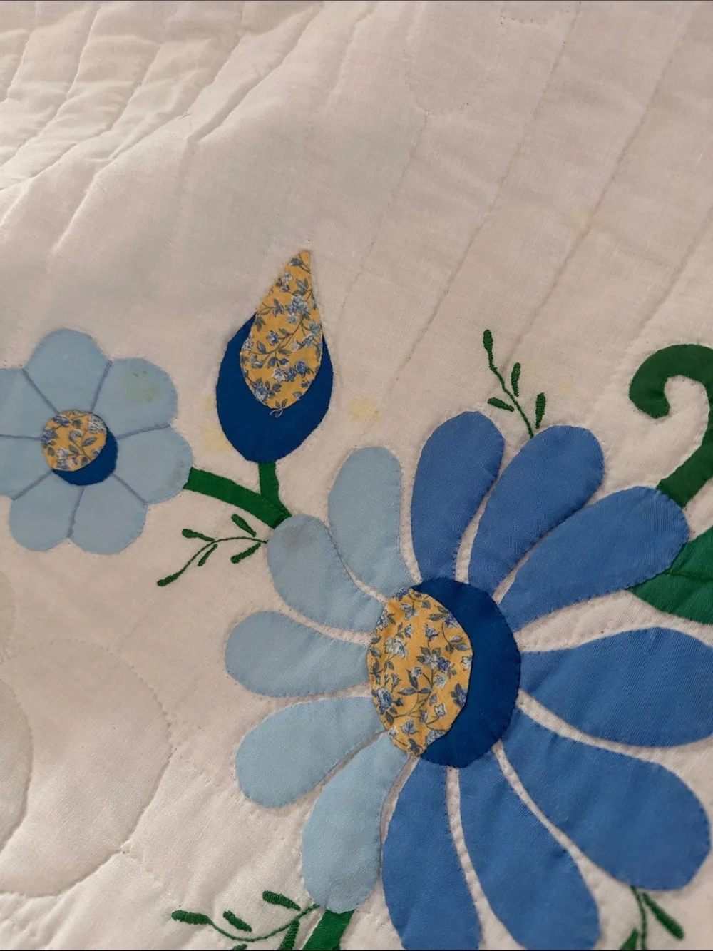 White Quilted Floral Bedspread with Blue and Green Accents